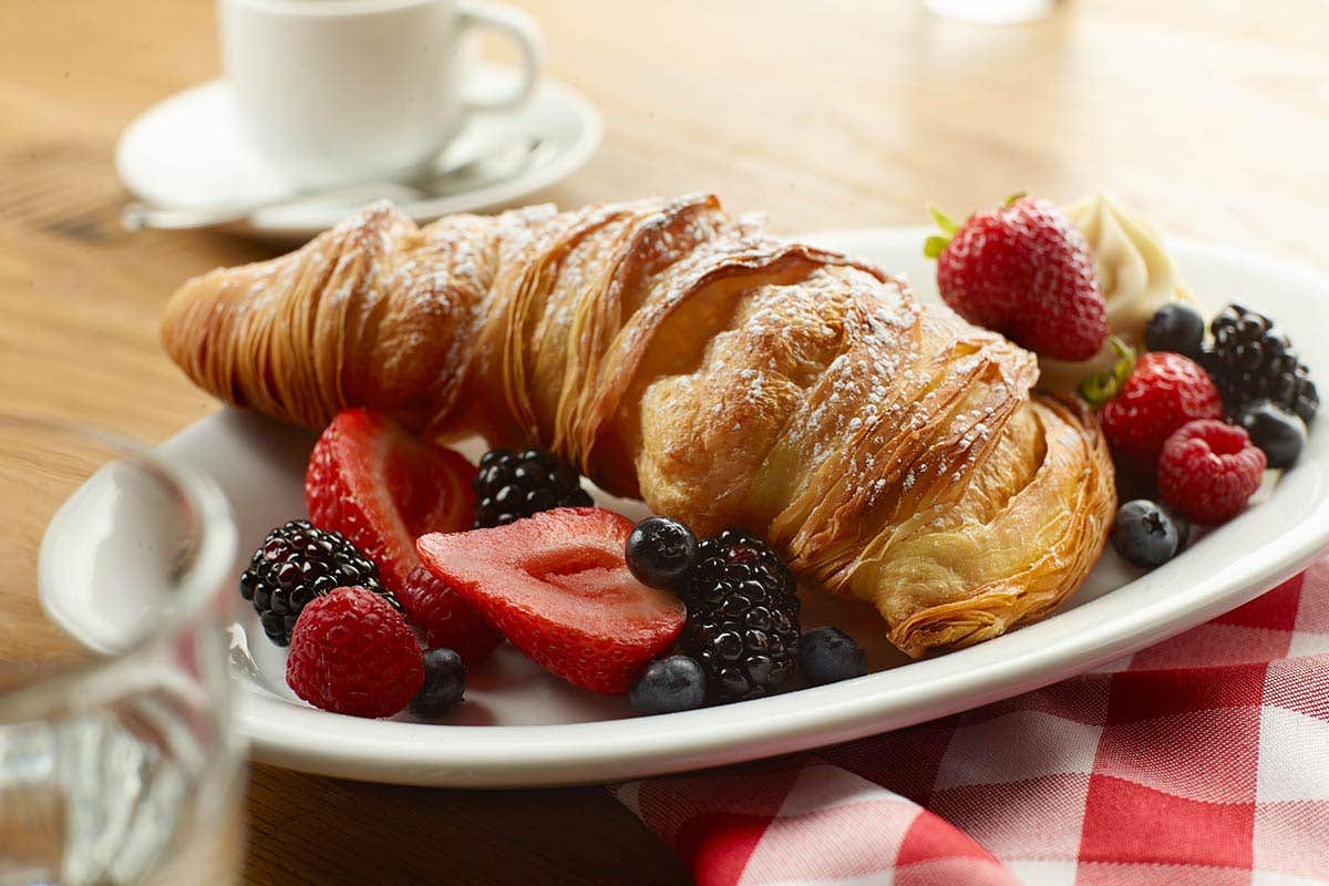 A croissant like pastry shaped like a lobster tail.