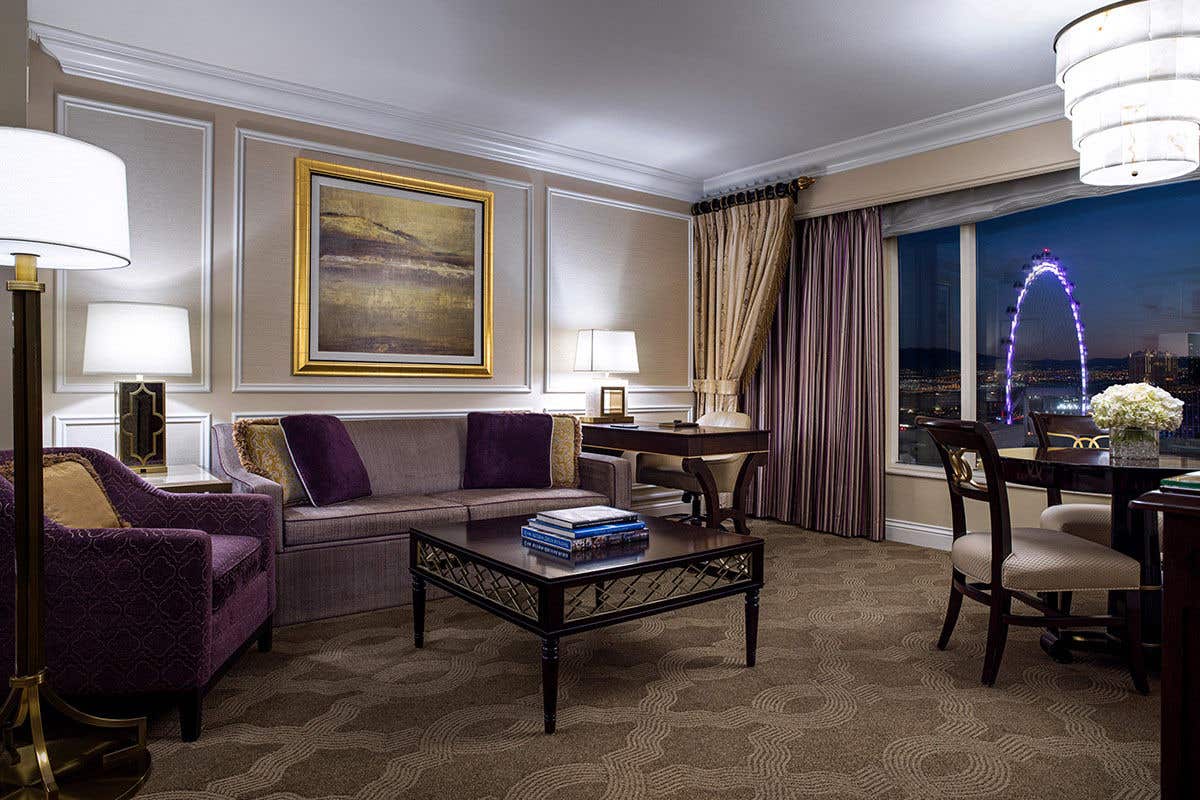 A living space in a suite at The Venetian with a night view