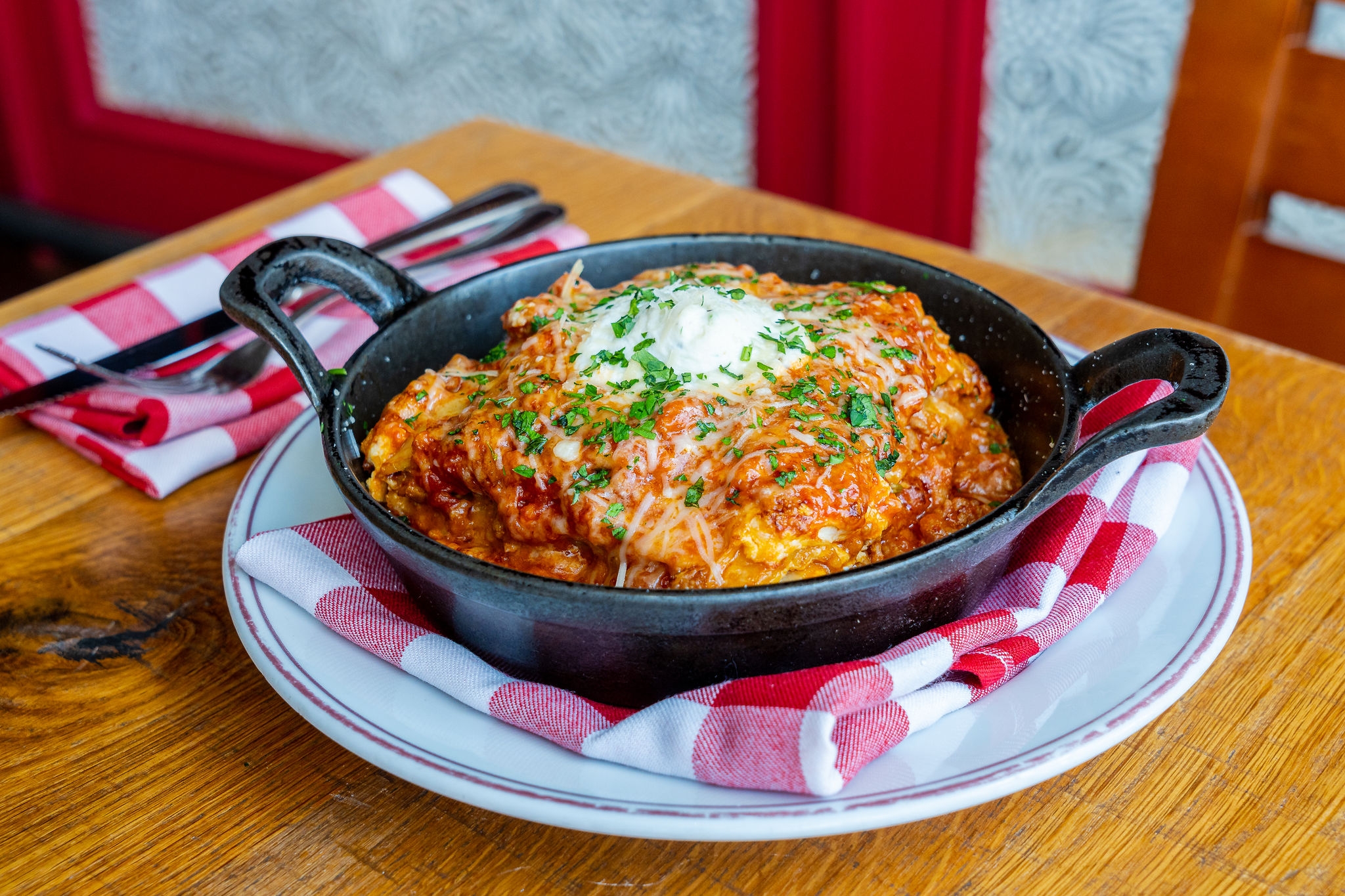 Cast iron pan full of lasagna