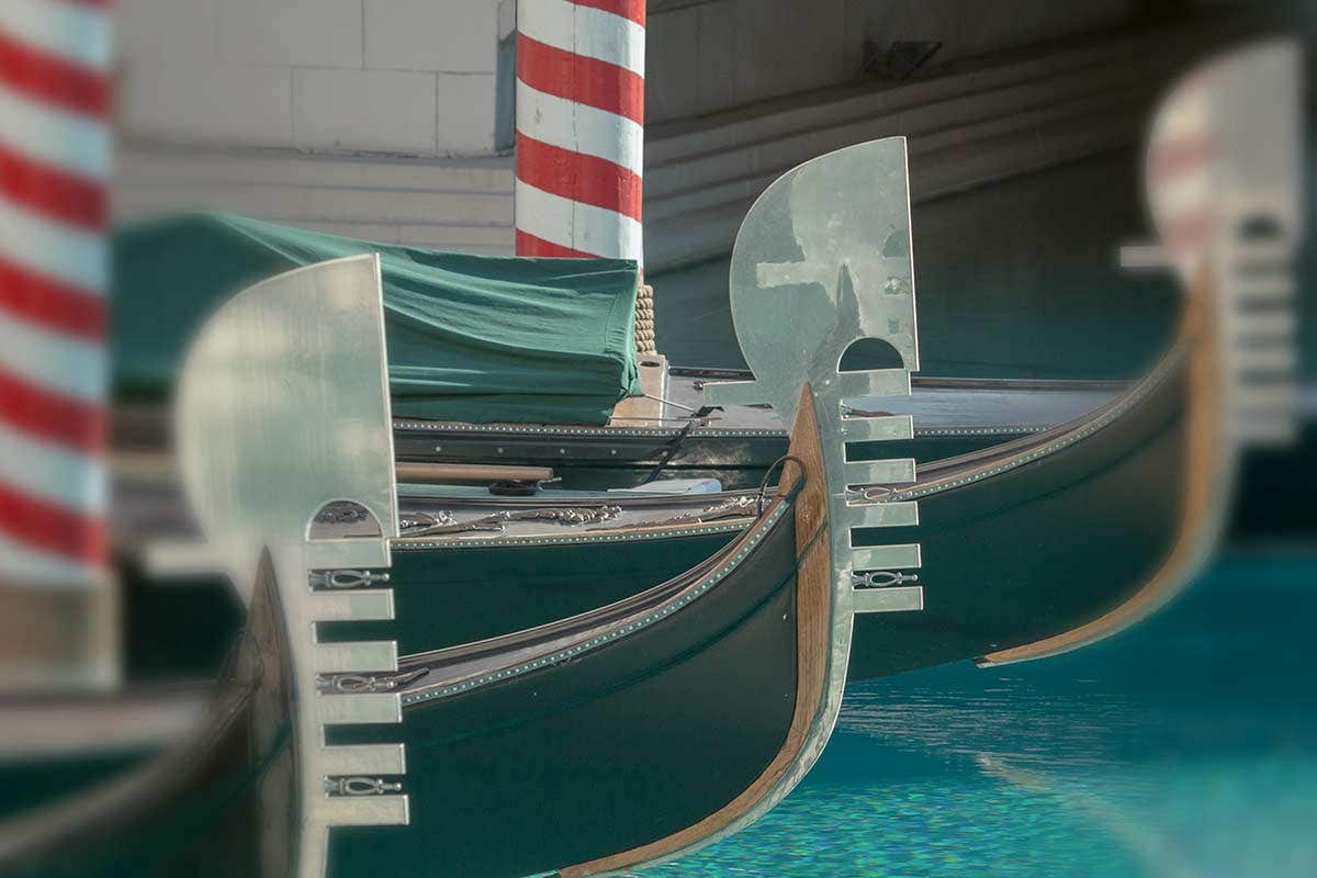 A close-up shot of the front of three gondola boats.