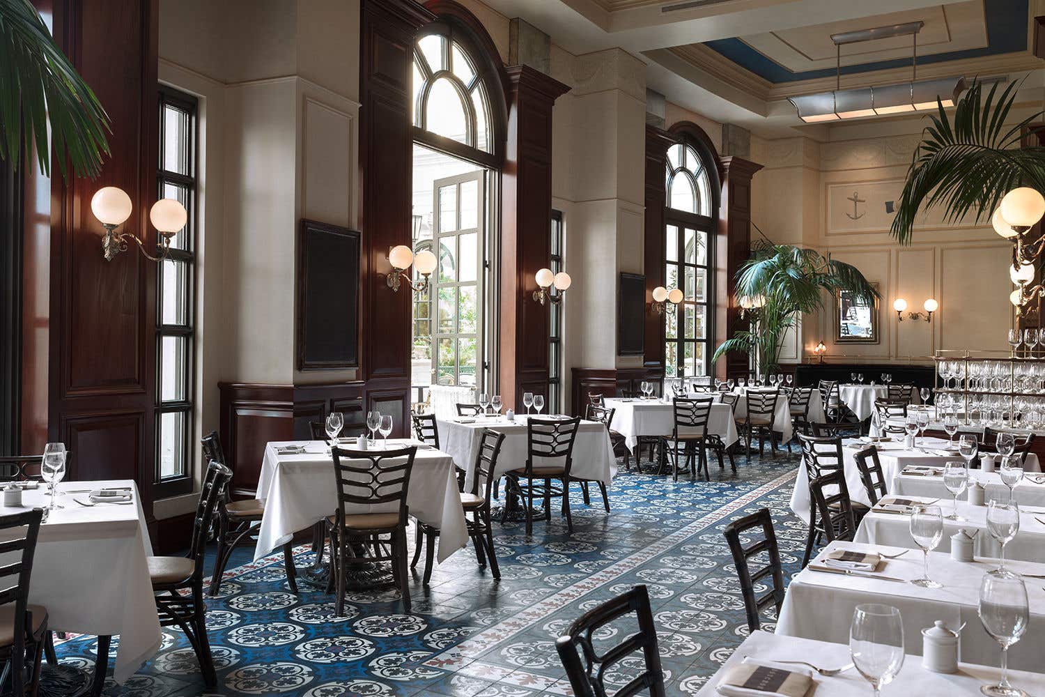 interior of a restaurant, with tables set for service.