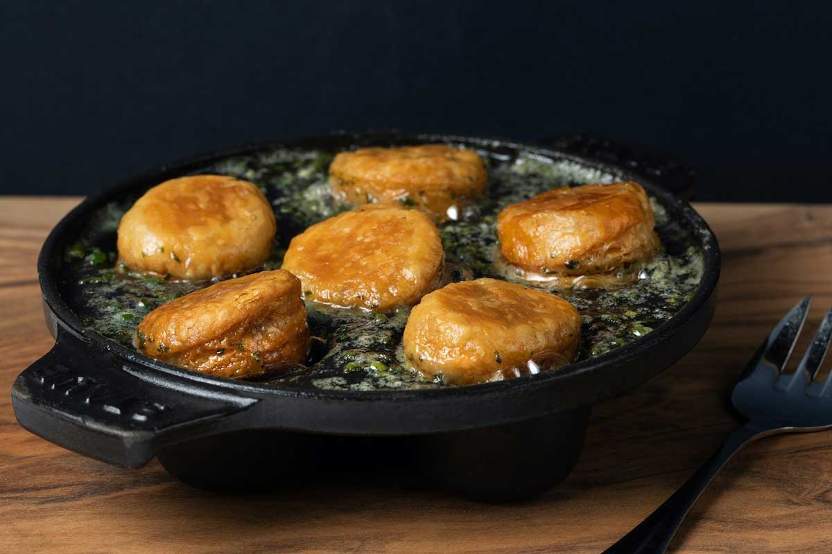 Golden escargots served in butter