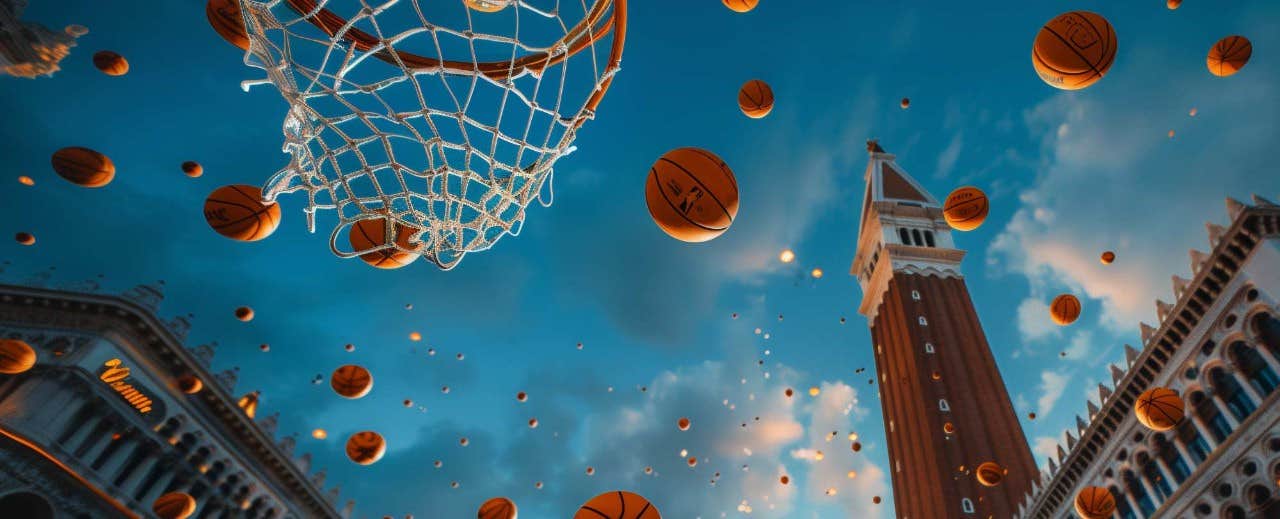 Dozens of basketballs float mid-air against a backdrop of historic buildings and a tower, with a basketball hoop in view.