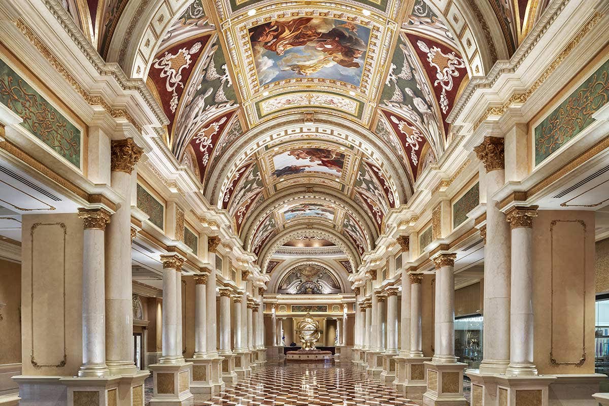 A view of the Grand Colonnade with an ornate painted ceiling.