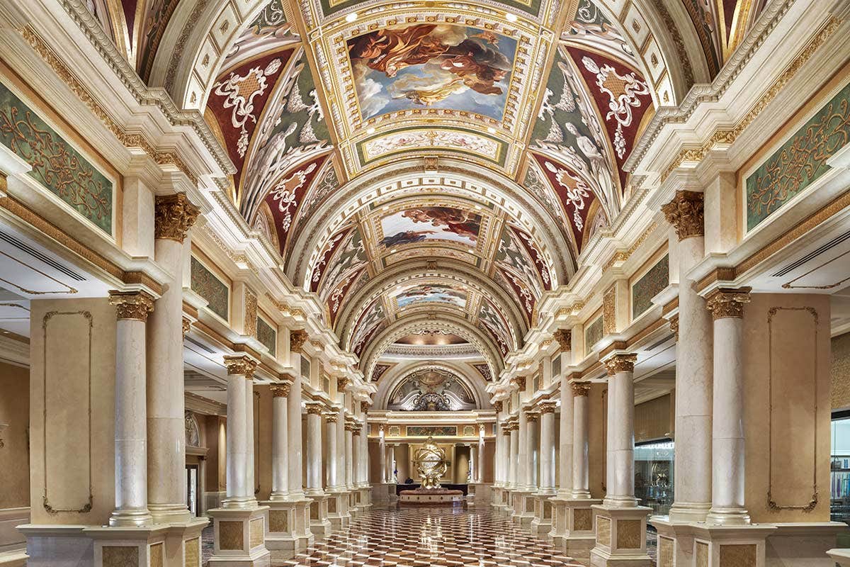 A view of the Grand Colonnade with an ornate painted ceiling.