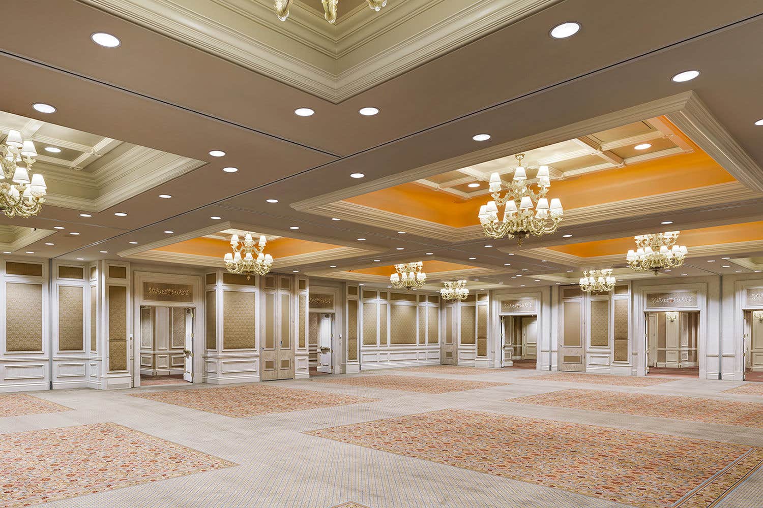 Interior of an empty ballroom at the Venetian Resort with chandeliers, vaulted ceiling, and beautiful decor.