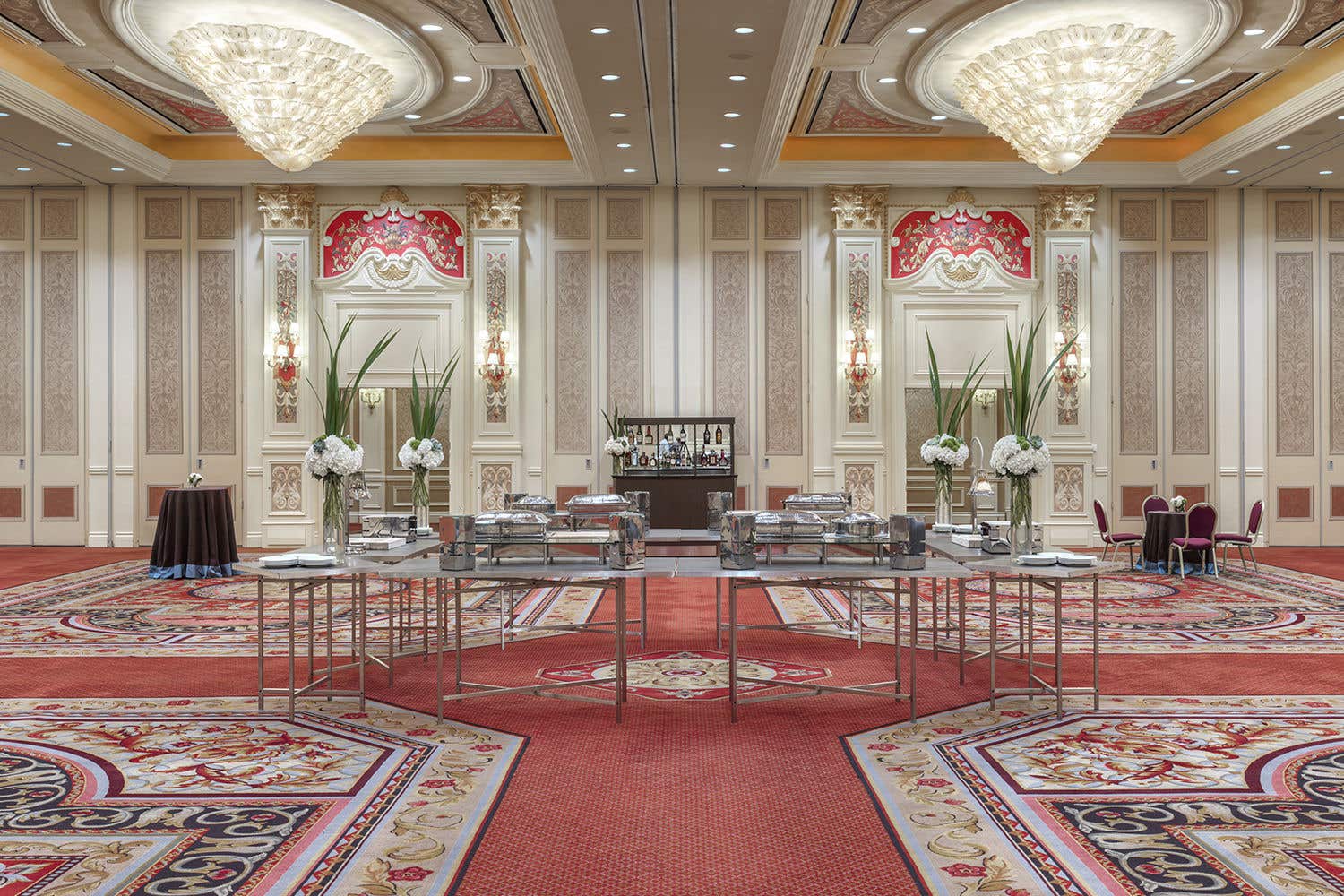 Ballroom with a bunch of tables and chairs, setup for an event at the Venetian Resort.