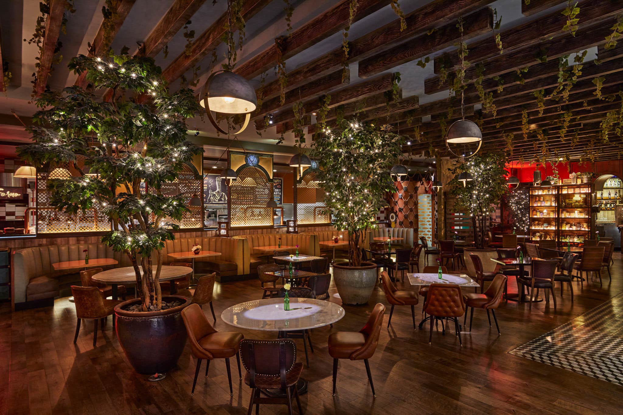 Interior of Mercato Della Pescheria with lit up trees.