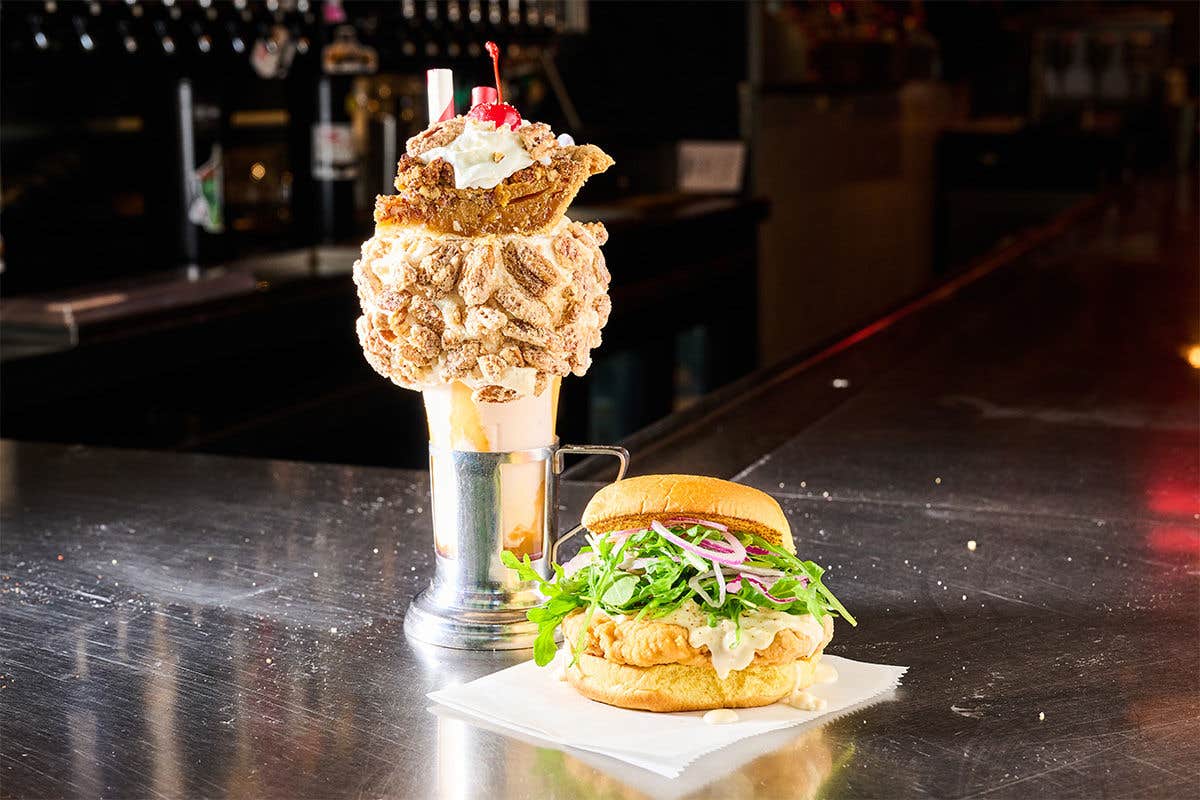 Pecan Pie CrazyShake next to a Chicken Fried Turkey Sandwich at Black Tap Craft Burgers & Beer