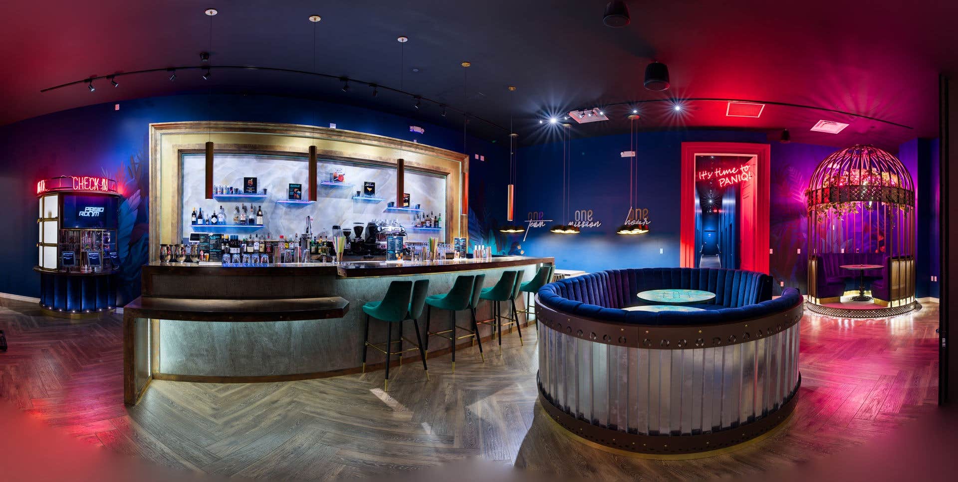 Blue bar area with round booth tables.