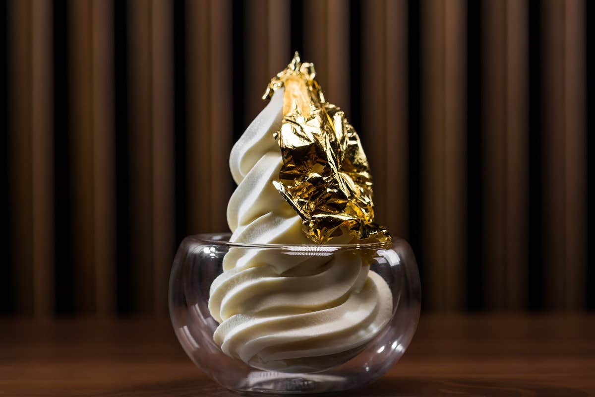 Soft serve ice cream with gold leaf garnish.