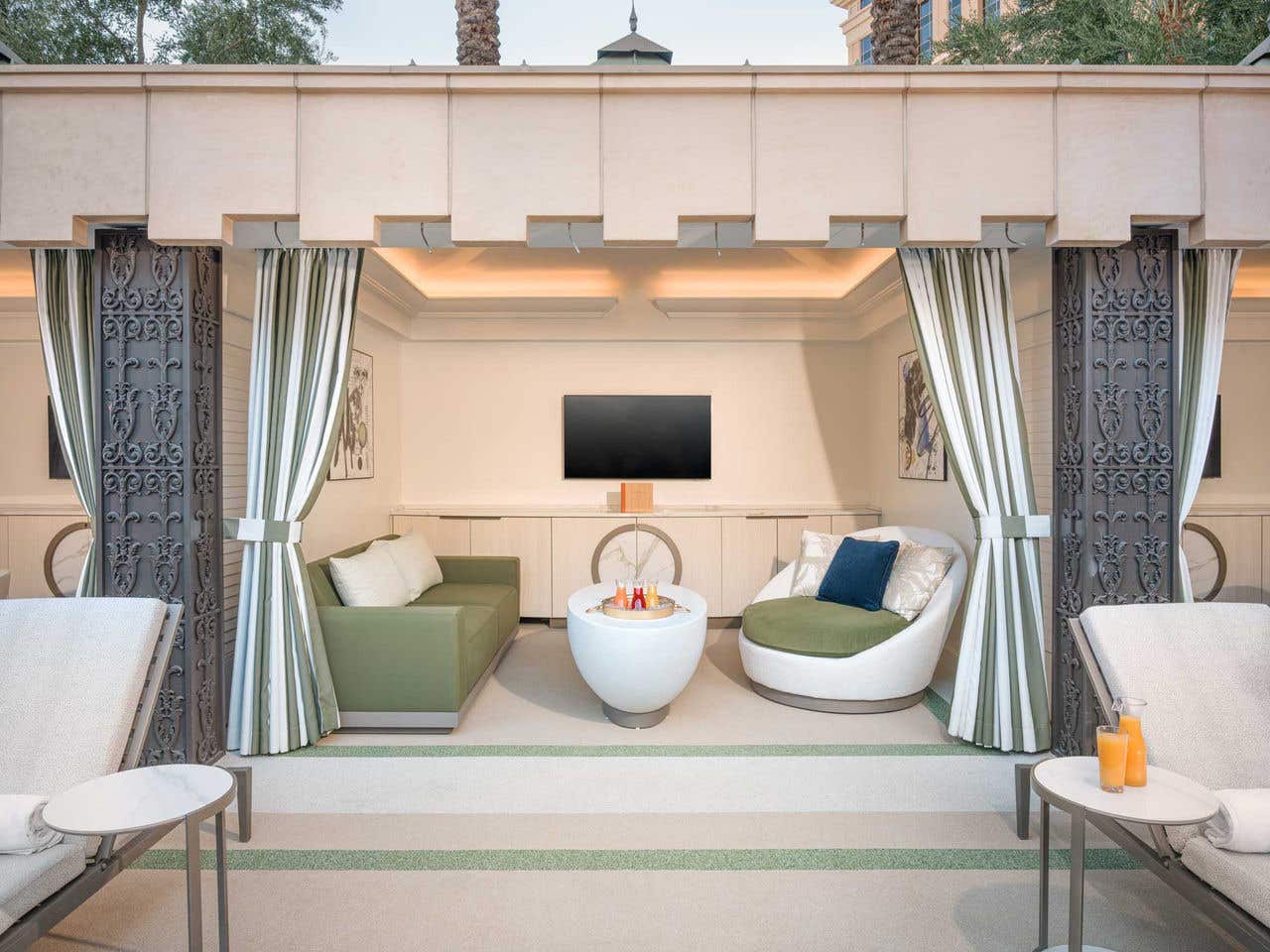 Premium Cabana at The Palazzo Pool Deck featuring a seating area, table, and television