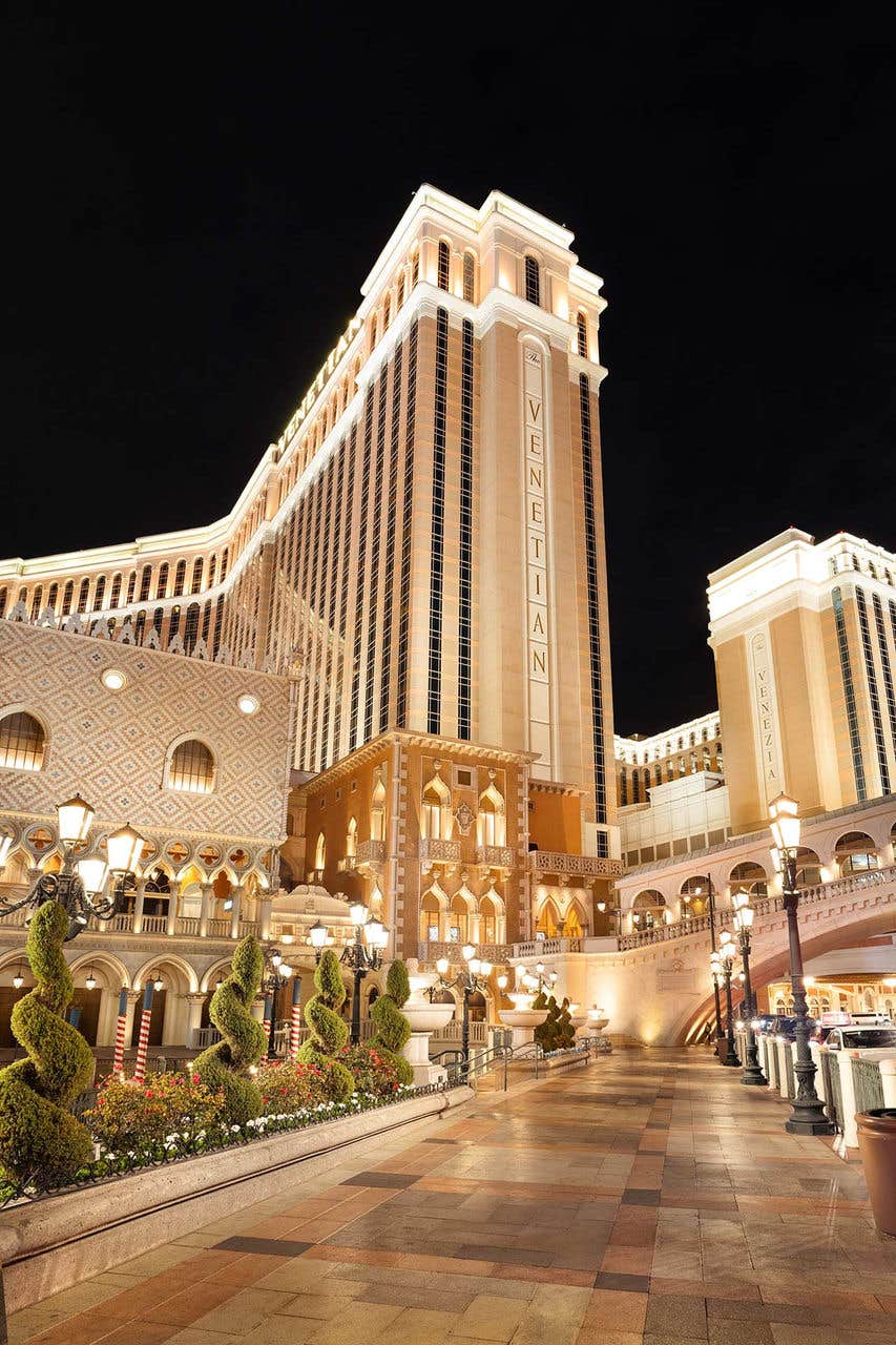 Exterior night view of the brightly lit Venetian tower