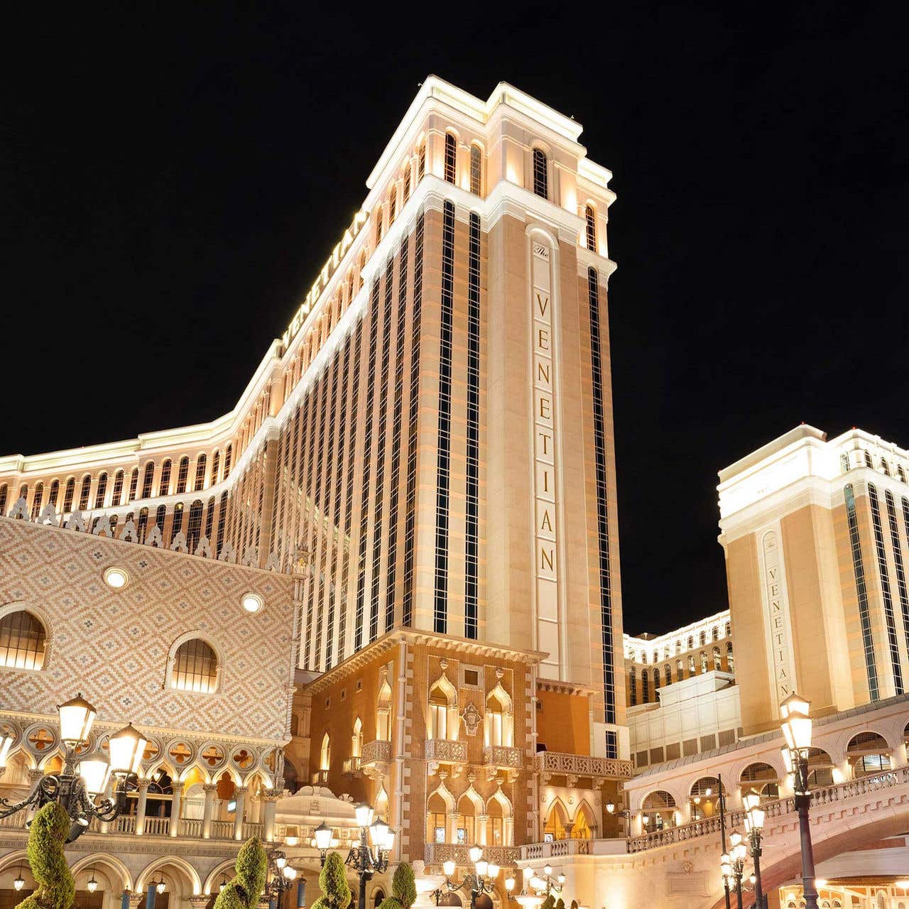 Exterior night view of the brightly lit Las Vegas hotel, The Venetian Resort.