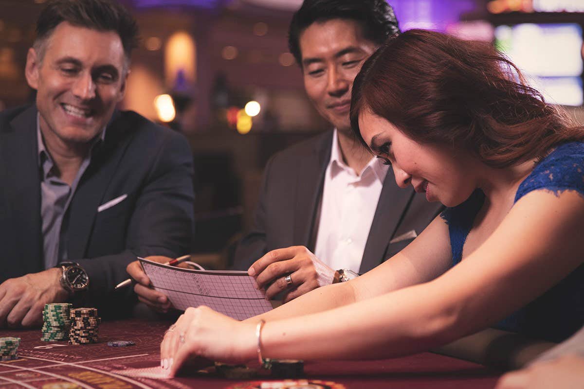 Three people playing poker