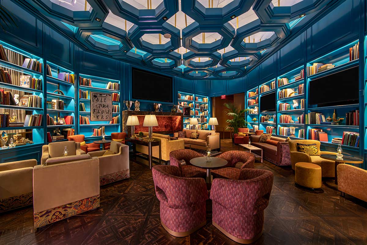 Interior of Juliet Cocktail Room with lounge chairs, and bookshelves 