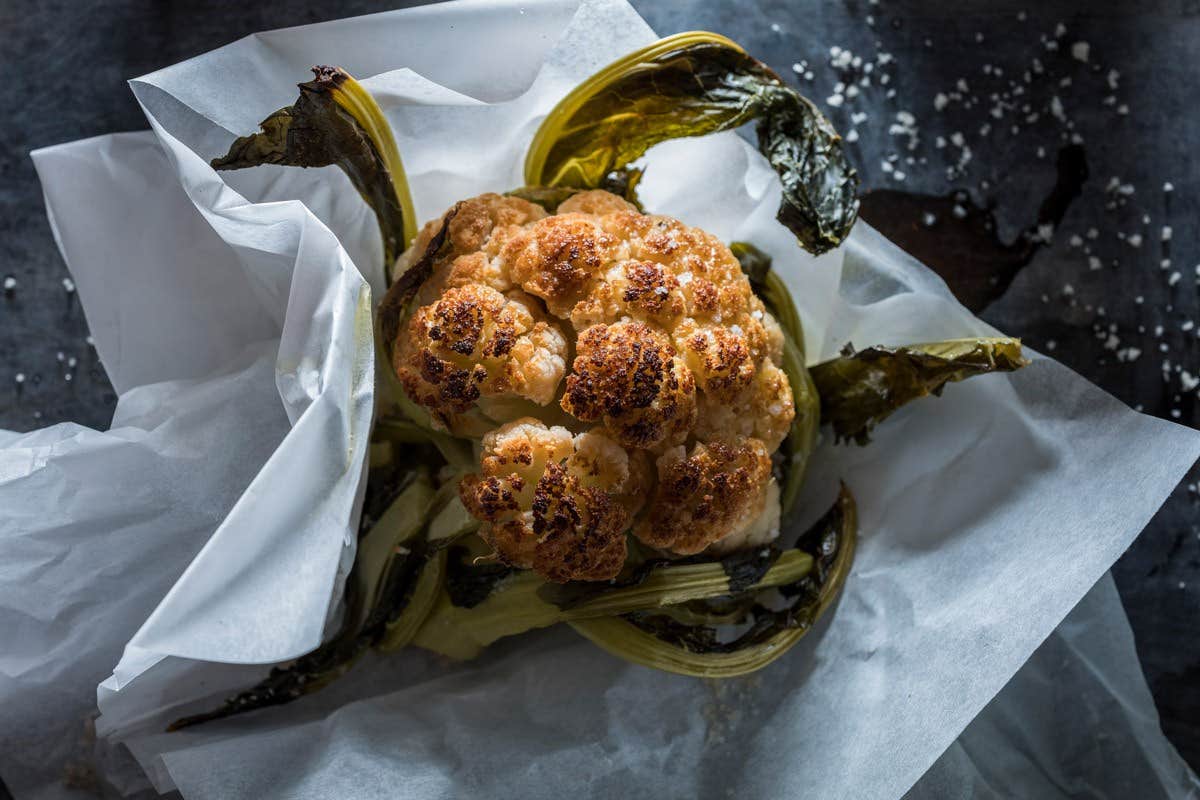 Roasted whole head of cauliflower.