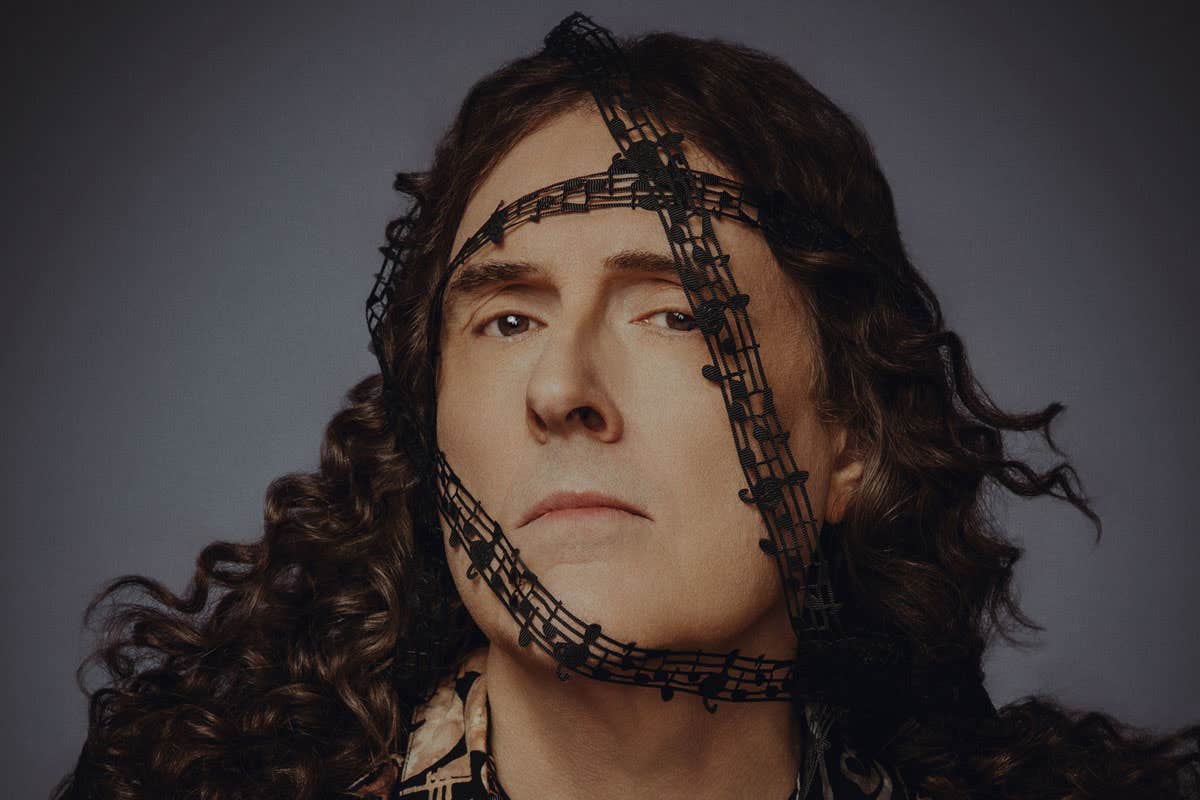 Weird Al with a ribbon of music notes around his face.